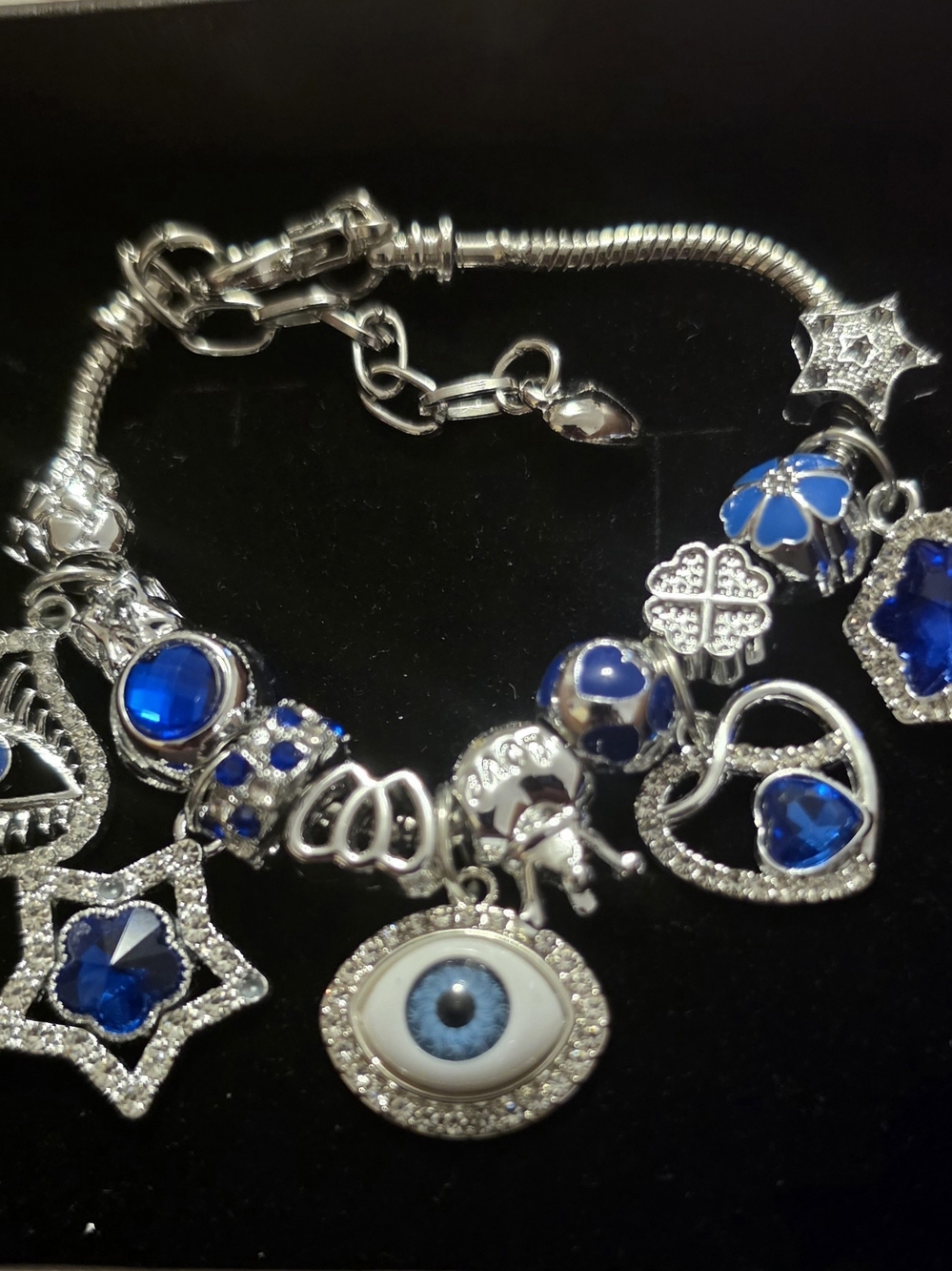 Silver Charm Bracelet with Blue Gem and Evil Eye Pendant